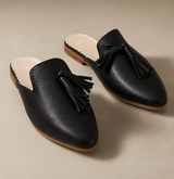 Black full-grain leather mule with tassel