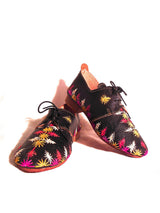 Black and handwoven raffia derby shoe with raffia
