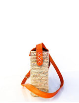 Handwoven leather and handwoven raffia shoulder bag with raffia