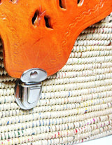 Handwoven leather and handwoven raffia shoulder bag with raffia