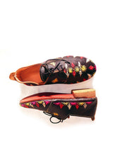 Black and handwoven raffia derby shoe with raffia