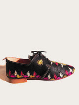 Black and handwoven raffia derby shoe with raffia